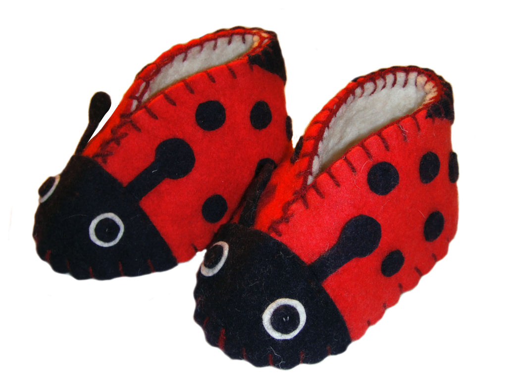 Ladybug Zooties of red and black felt with soft off-white felt interior.